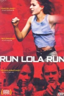 Poster of the German film “Run Lola Run,” showing a red-haired woman in a blue tank top running against a red background with two men below her